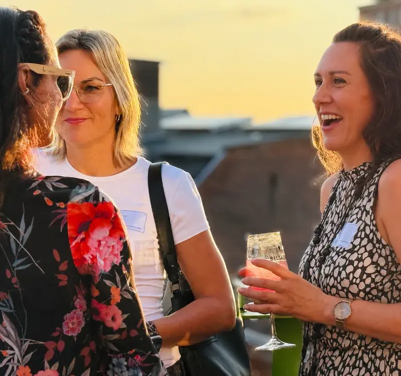 women-socializing-sunset-event